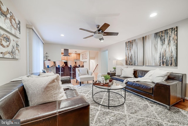 living room with recessed lighting, ceiling fan, and wood finished floors