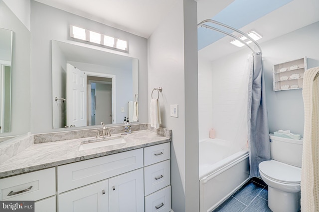 bathroom with vanity, tile patterned floors, shower / tub combo, and toilet