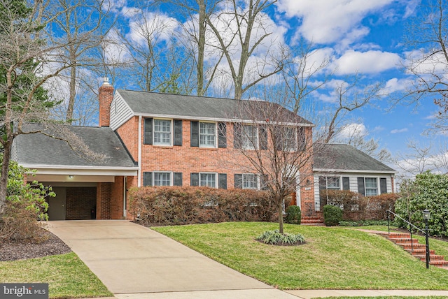 view of front of property featuring a carport, concrete driveway, a front yard, brick siding, and a chimney