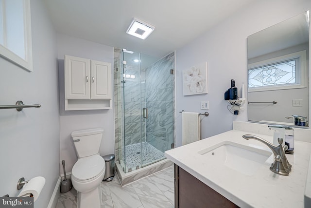 bathroom featuring vanity, baseboards, a shower stall, toilet, and marble finish floor