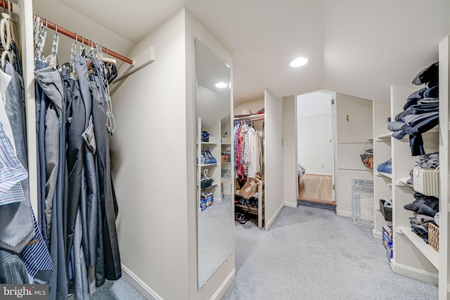 walk in closet featuring carpet