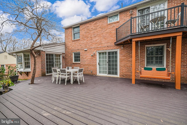 wooden deck with outdoor dining space