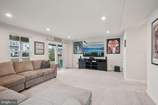 living room featuring recessed lighting, baseboards, and carpet floors