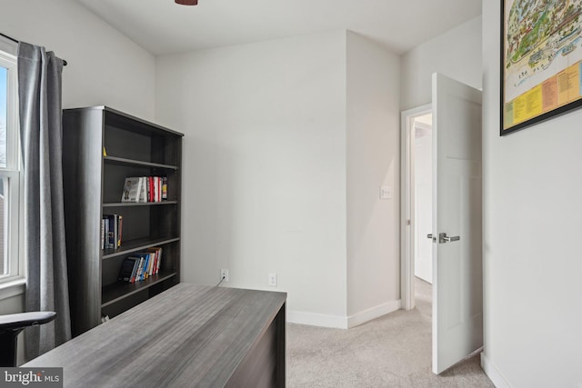 bedroom with baseboards and carpet