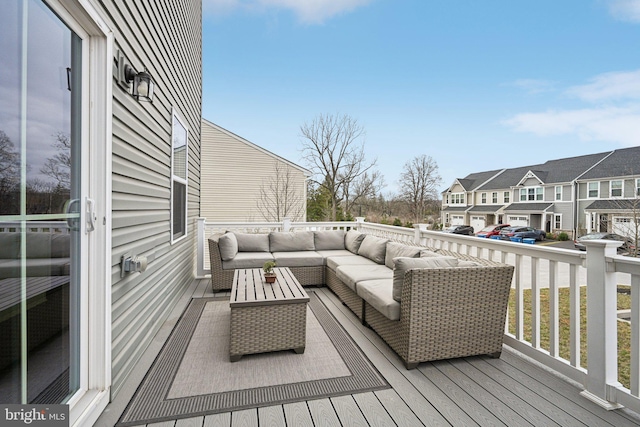 wooden terrace featuring a residential view and an outdoor hangout area