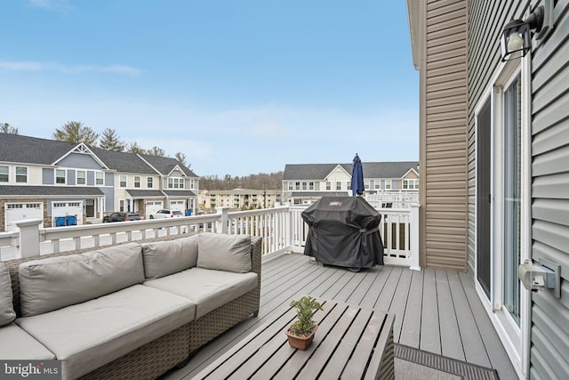 deck with an outdoor living space, grilling area, and a residential view