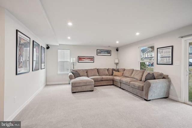 living room featuring recessed lighting, baseboards, and carpet