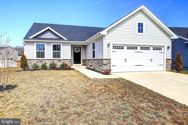 view of front facade featuring concrete driveway, a front lawn, stone siding, and a shingled roof
