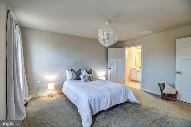 bedroom with visible vents, baseboards, light carpet, ensuite bathroom, and an inviting chandelier