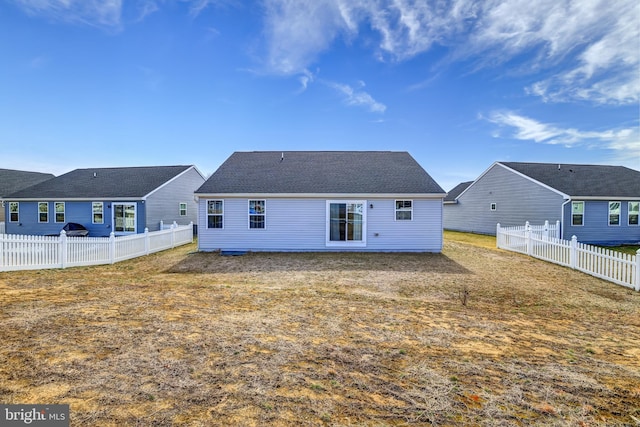 back of property featuring a fenced backyard