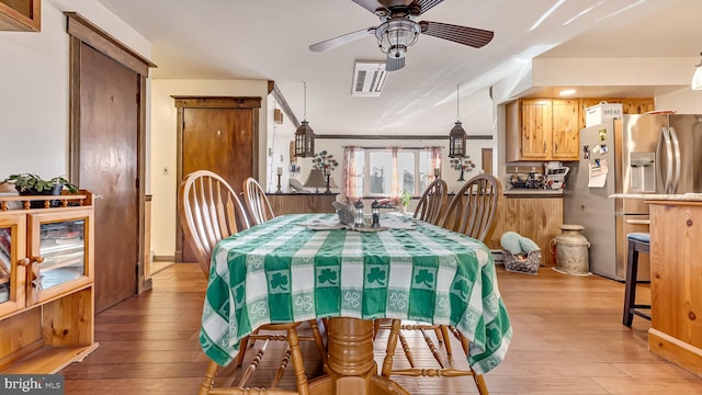 dining room featuring a ceiling fan and light wood-type flooring