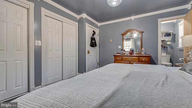 bedroom featuring baseboards and crown molding