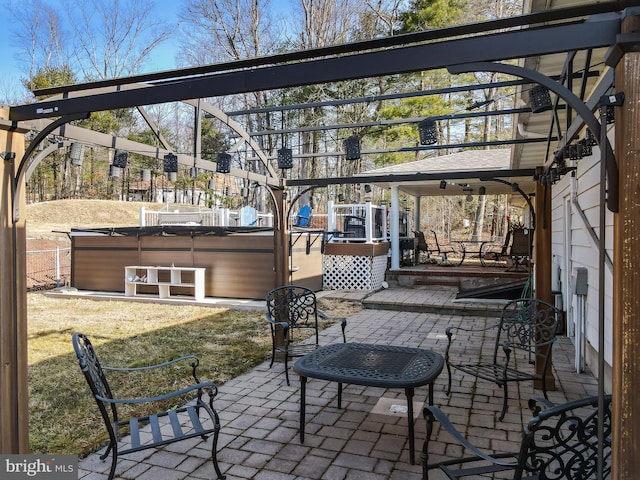 view of patio featuring a pergola and a hot tub