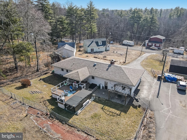 aerial view featuring a wooded view