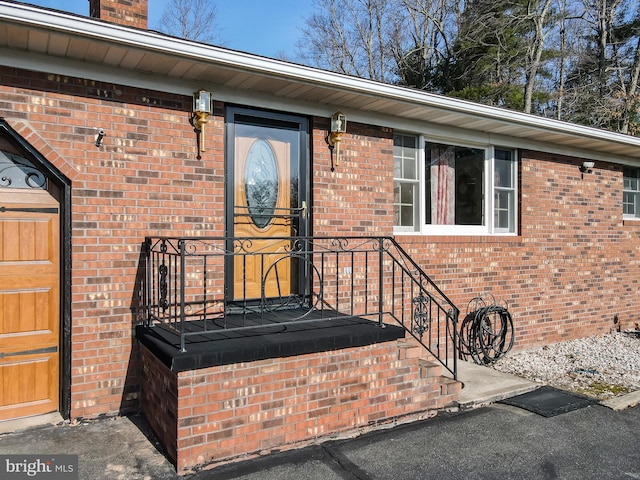 entrance to property with brick siding