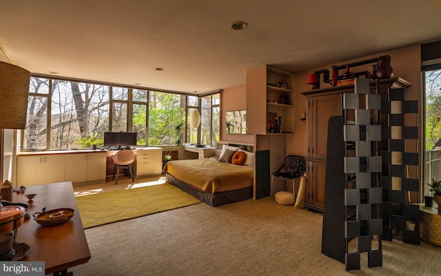 carpeted bedroom featuring recessed lighting and multiple windows