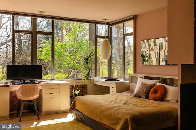 bedroom featuring a wall of windows