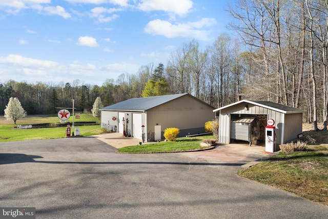 detached garage with aphalt driveway