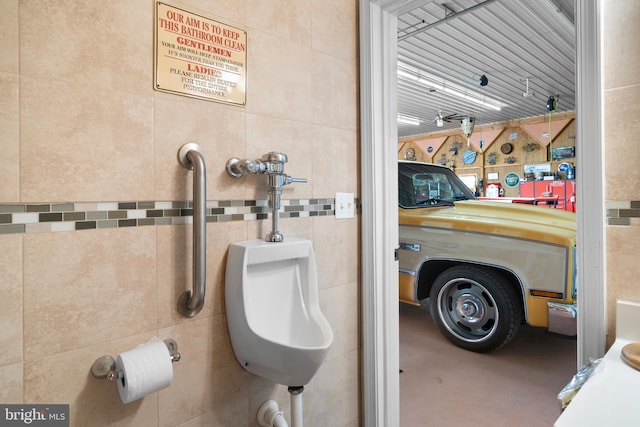 interior space with tile walls