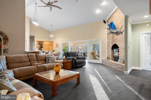 living area featuring high vaulted ceiling, a ceiling fan, a large fireplace, dark carpet, and ornamental molding