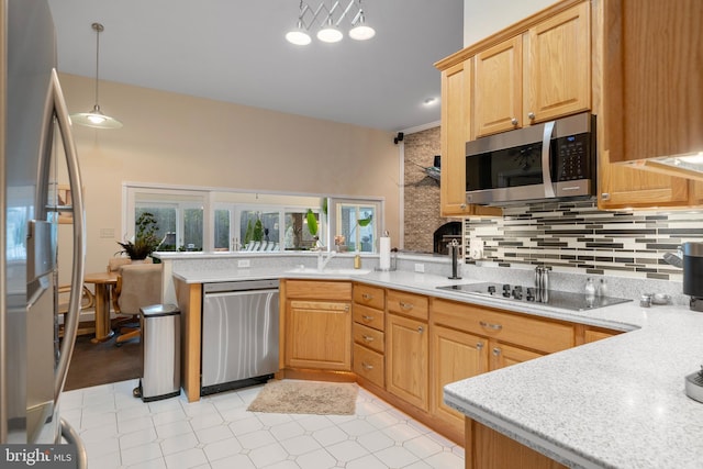 kitchen with stainless steel appliances, a peninsula, tasteful backsplash, light floors, and light brown cabinets