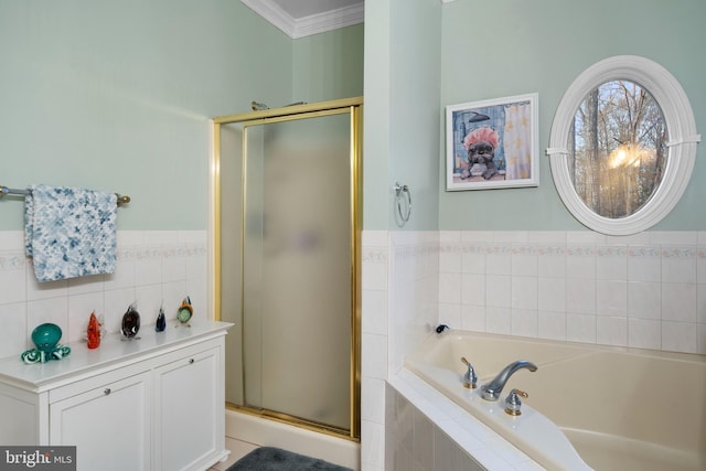 full bath featuring a bath, tile walls, wainscoting, a shower stall, and crown molding
