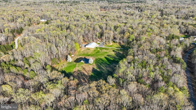 drone / aerial view with a view of trees
