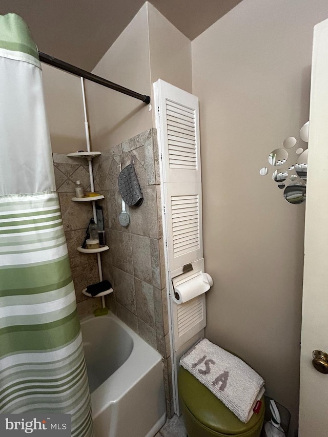2834 Edgecombe Cir S, Baltimore, MD 21215 - bathroom featuring shower / bath combo with shower curtain and toilet