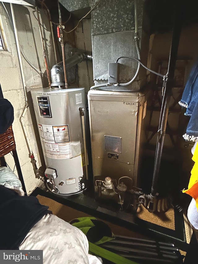 2834 Edgecombe Cir S, Baltimore, MD 21215 - utility room featuring water heater