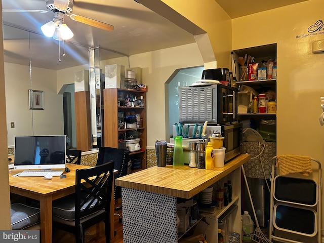 2834 Edgecombe Cir S, Baltimore, MD 21215 - dining space with ceiling fan and arched walkways