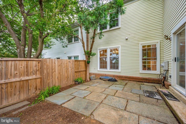 view of patio featuring fence