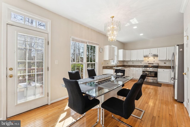 dining space featuring light wood finished floors, visible vents, baseboards, a chandelier, and recessed lighting