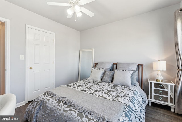 bedroom with a ceiling fan and wood finished floors