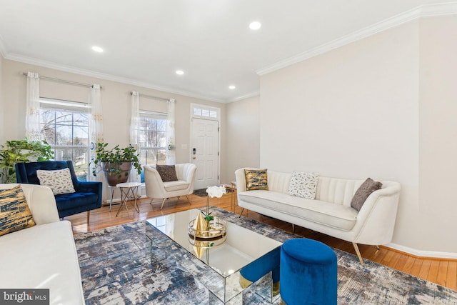 living area with crown molding, recessed lighting, wood finished floors, and baseboards