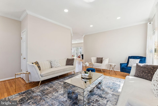 living room with crown molding, baseboards, and wood finished floors