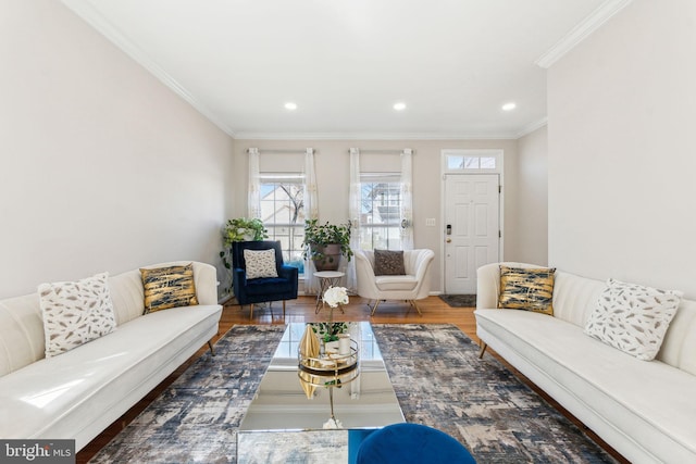 living area featuring recessed lighting, wood finished floors, and ornamental molding