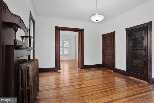 1033 Newton St NE, Washington, DC 20017 - unfurnished dining area featuring wood-type flooring and radiator heating unit