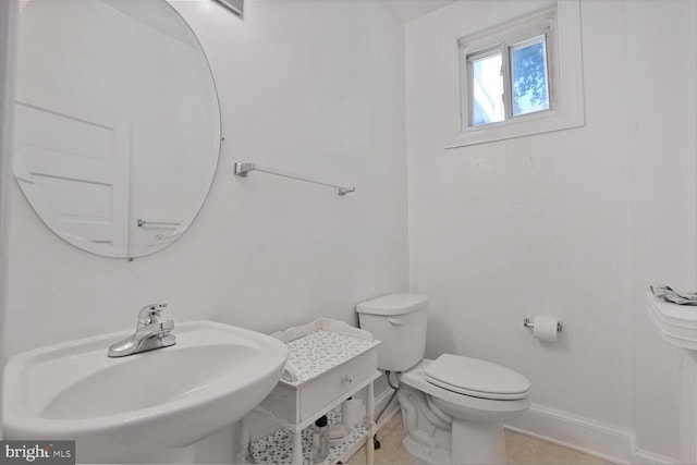1033 Newton St NE, Washington, DC 20017 - half bath with baseboards and a sink
