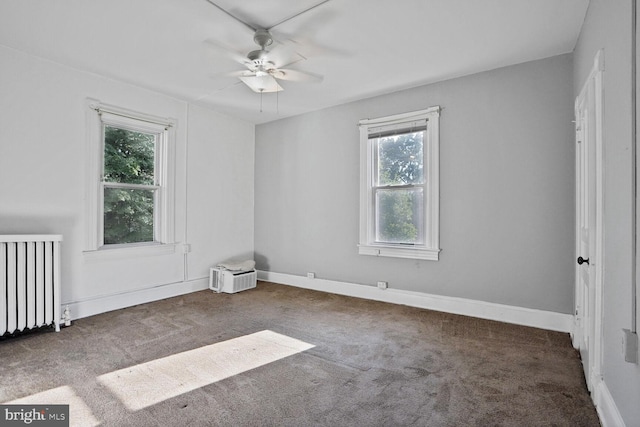 1033 Newton St NE, Washington, DC 20017 - unfurnished room with radiator heating unit, carpet floors, and ceiling fan