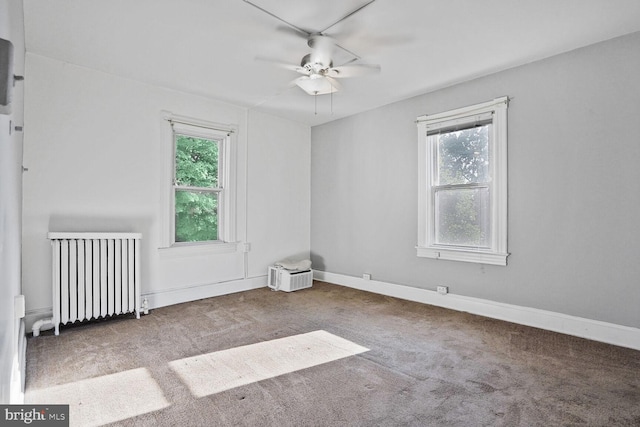 1033 Newton St NE, Washington, DC 20017 - unfurnished room featuring radiator heating unit, healthy amount of natural light, a ceiling fan, and carpet