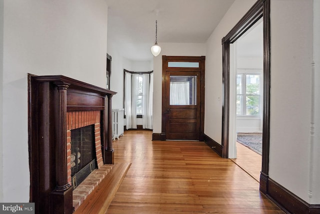 1033 Newton St NE, Washington, DC 20017 - foyer with a brick fireplace and hardwood / wood-style flooring