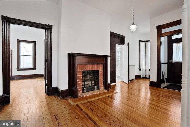 1033 Newton St NE, Washington, DC 20017 - unfurnished living room with a fireplace and light wood finished floors