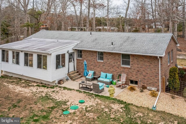 rear view of property featuring a patio area, an outdoor hangout area, roof with shingles, and entry steps