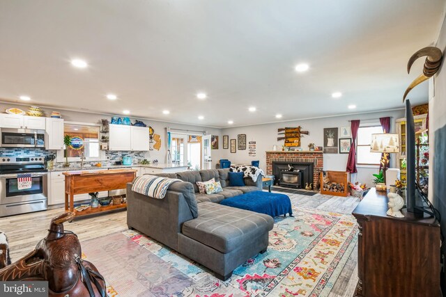 living room featuring recessed lighting and light wood-style flooring