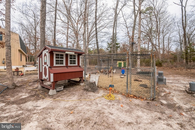view of poultry coop featuring cooling unit