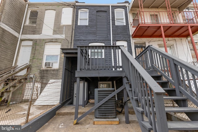 505 N Rose St, Baltimore, MD 21205 - rear view of house with stairway, cooling unit, and central AC