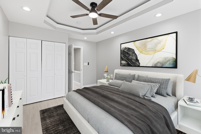 505 N Rose St, Baltimore, MD 21205 - bedroom featuring ceiling fan, light wood-type flooring, recessed lighting, a closet, and a raised ceiling