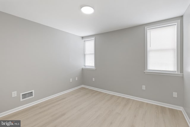505 N Rose St, Baltimore, MD 21205 - empty room with visible vents, light wood-style floors, and baseboards