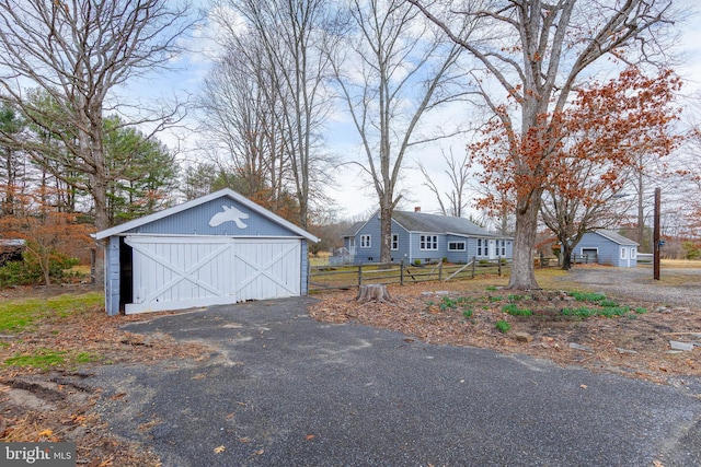 detached garage with fence