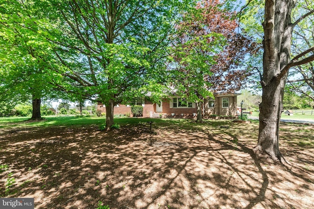 exterior space with brick siding